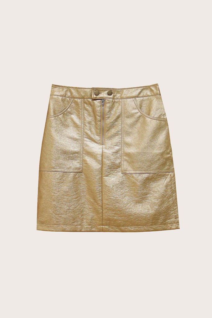 Jupe dorée courte avec fermeture à zip et bouton sur le devant vêtement femme tenue festive