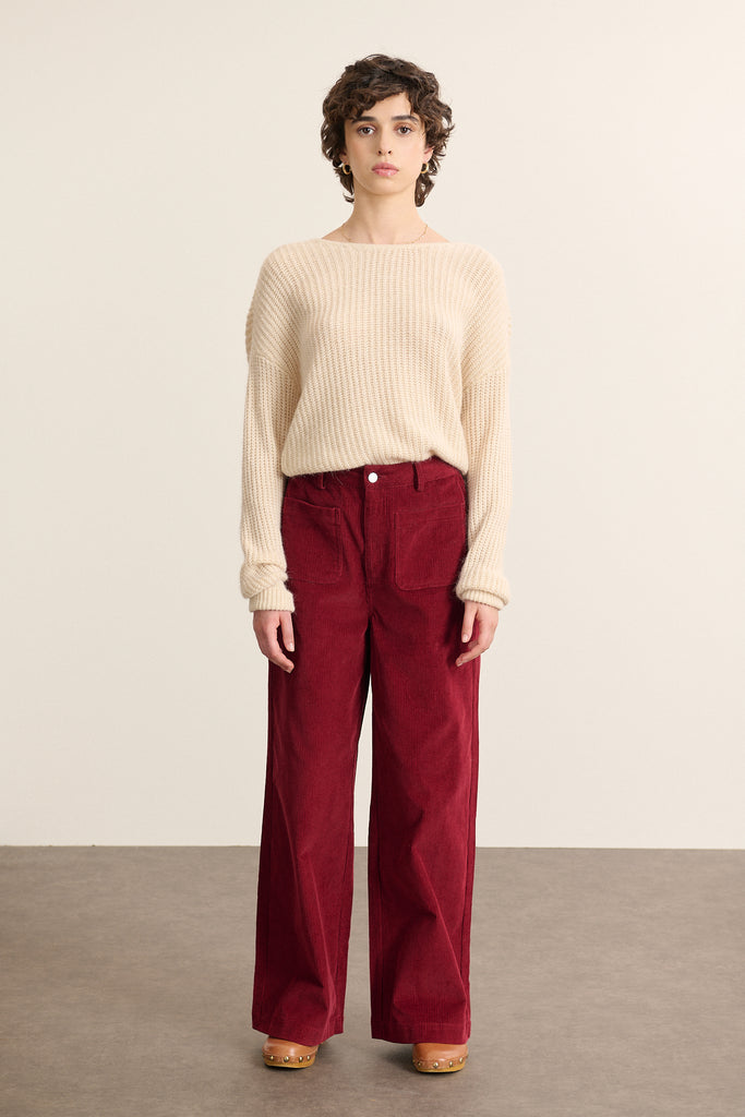 Fermeture par zip et bouton ton sur ton, placés sur ceinture droite avec passants pour ceinture fine Garance Paris.